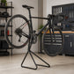 Foldable road bike repair stand in a garage
