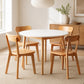 5 piece round dining table and chair set in a dining room