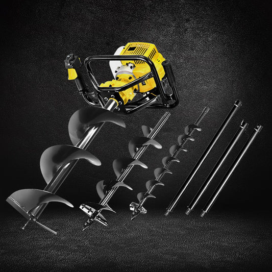 Yellow and black electric drill with interchangeable drill bits on a dark background