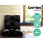 Black recliner chair in a room with a window and stone wall, featuring 'Cool vibes' text and icons.