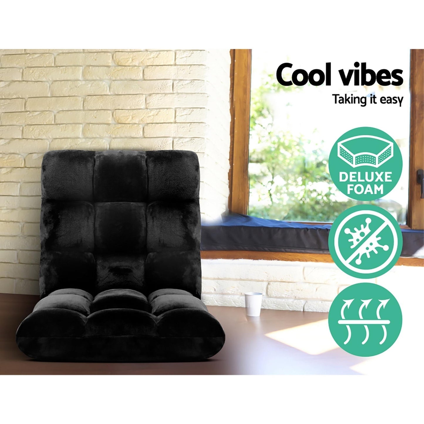 Black recliner chair in a room with a window and stone wall, featuring 'Cool vibes' text and icons.