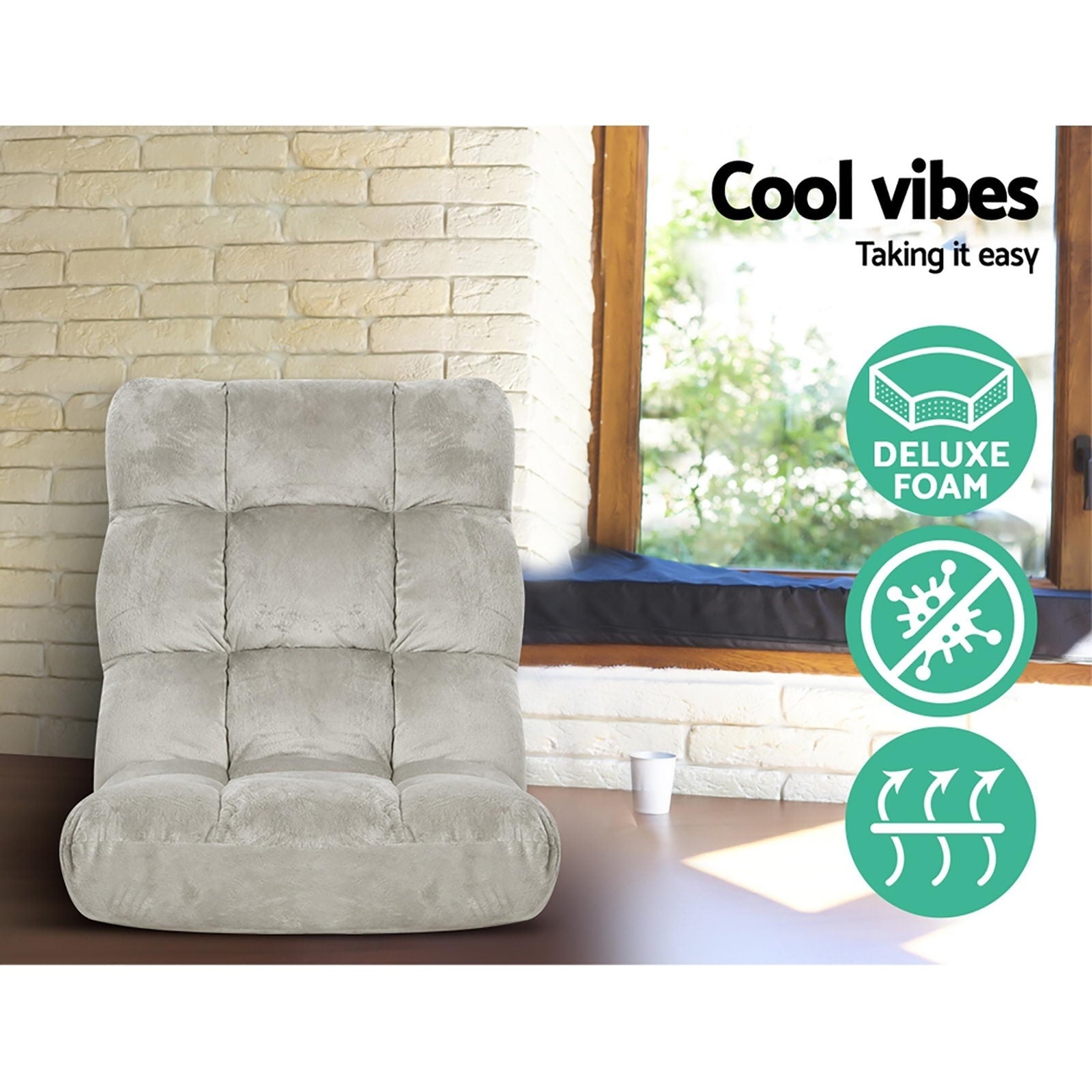 Gray recliner chair in a room with a stone wall and window, featuring 'Cool vibes' text and icons.