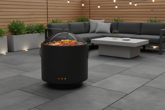 Black metal fire pit with mesh screen on a white background