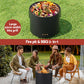 Black fire pit and BBQ grill with food on a grassy background, and people sitting around it.
