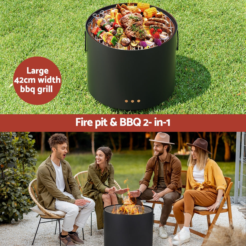 Black fire pit and BBQ grill with food on a grassy background, and people sitting around it.
