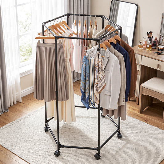Clothing rack with clothes in a room with a desk and mirror