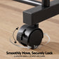 Black caster wheel on a wooden floor with text indicating 360-degree movement and braking capabilities.