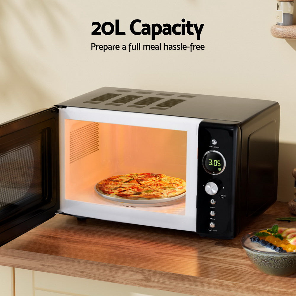 Microwave oven with a pizza inside on a wooden countertop, labeled '20L Capacity'.