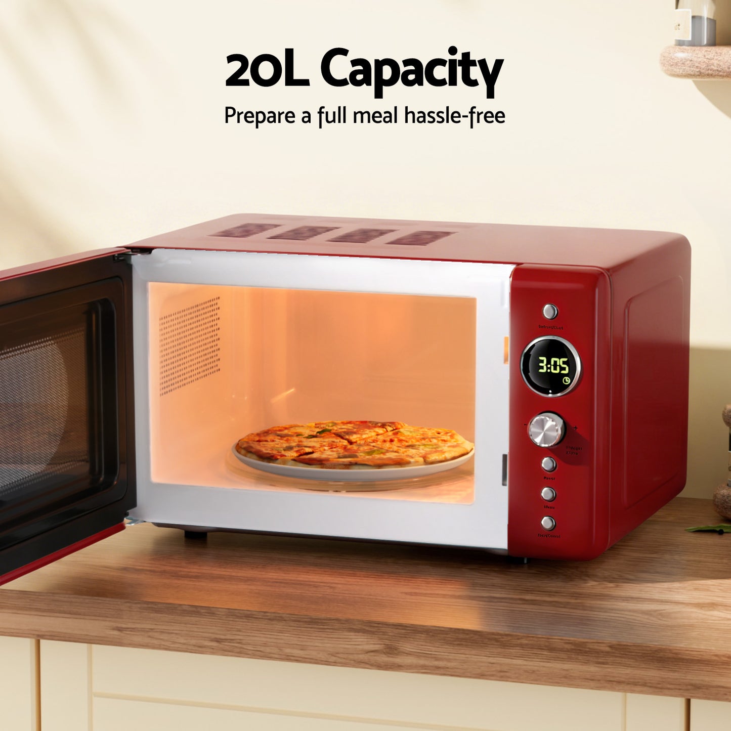 Red microwave oven with a pizza inside on a wooden countertop, labeled '20L Capacity'.