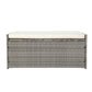 Gray wicker storage bench with a white cushion on a white background