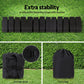Black straps with buckles on grass, storage strap, and carry bag on a green background