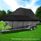 Black boat cover on a trailer with a boat underneath, set against a green lawn and trees.