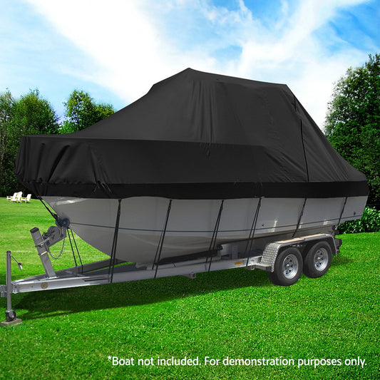 Black boat cover on a trailer with a boat underneath, set against a green lawn and trees.