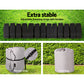 Set of adjustable fastening straps with buckles and storage and carry bags on a grassy background.