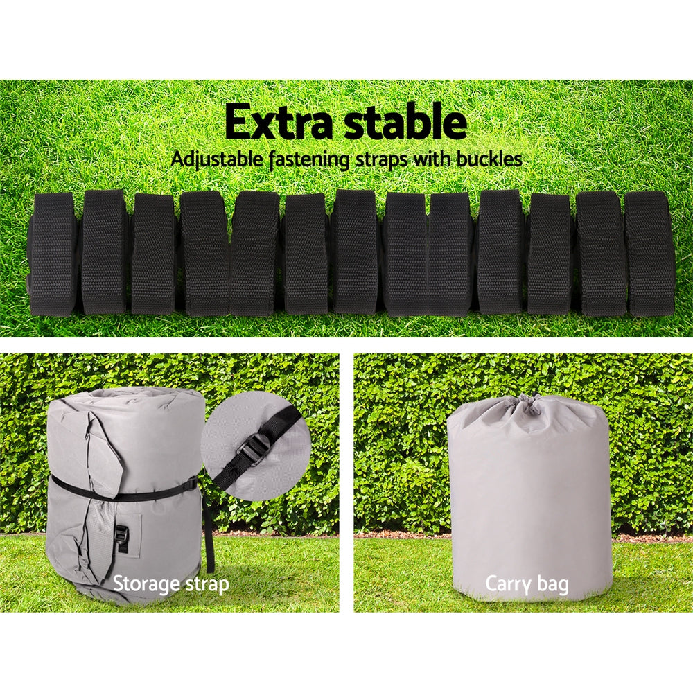 Set of adjustable fastening straps with buckles and storage and carry bags on a grassy background.