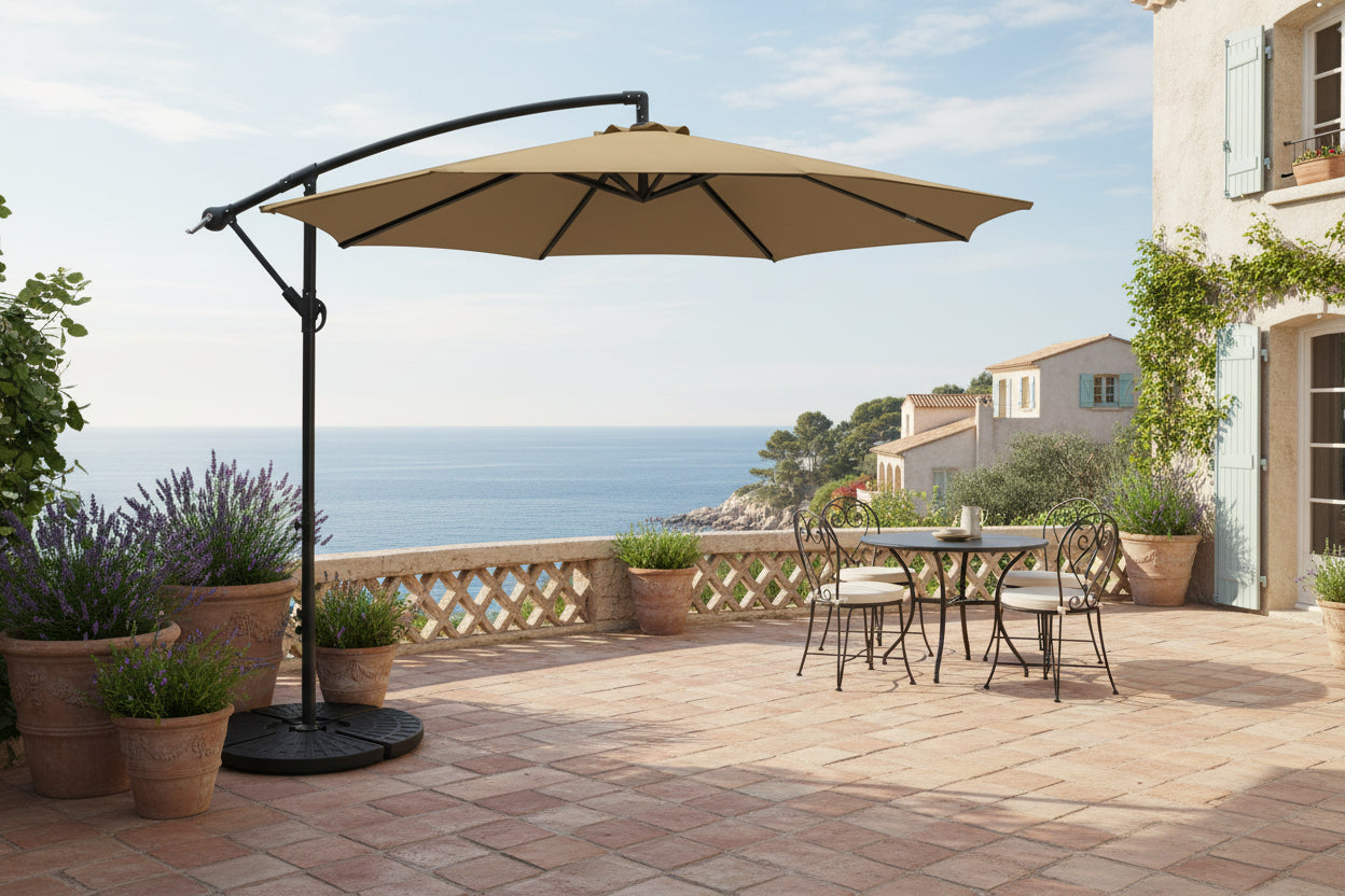Beige patio umbrella with black stand on a white background