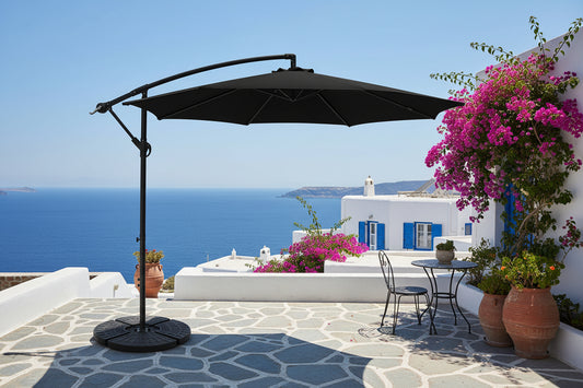 Blue patio umbrella with a black base on a white background