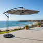 Gray patio umbrella with a black stand on a white background