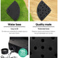 Black water base product with text on water capacity and features, shown on grass and wood.