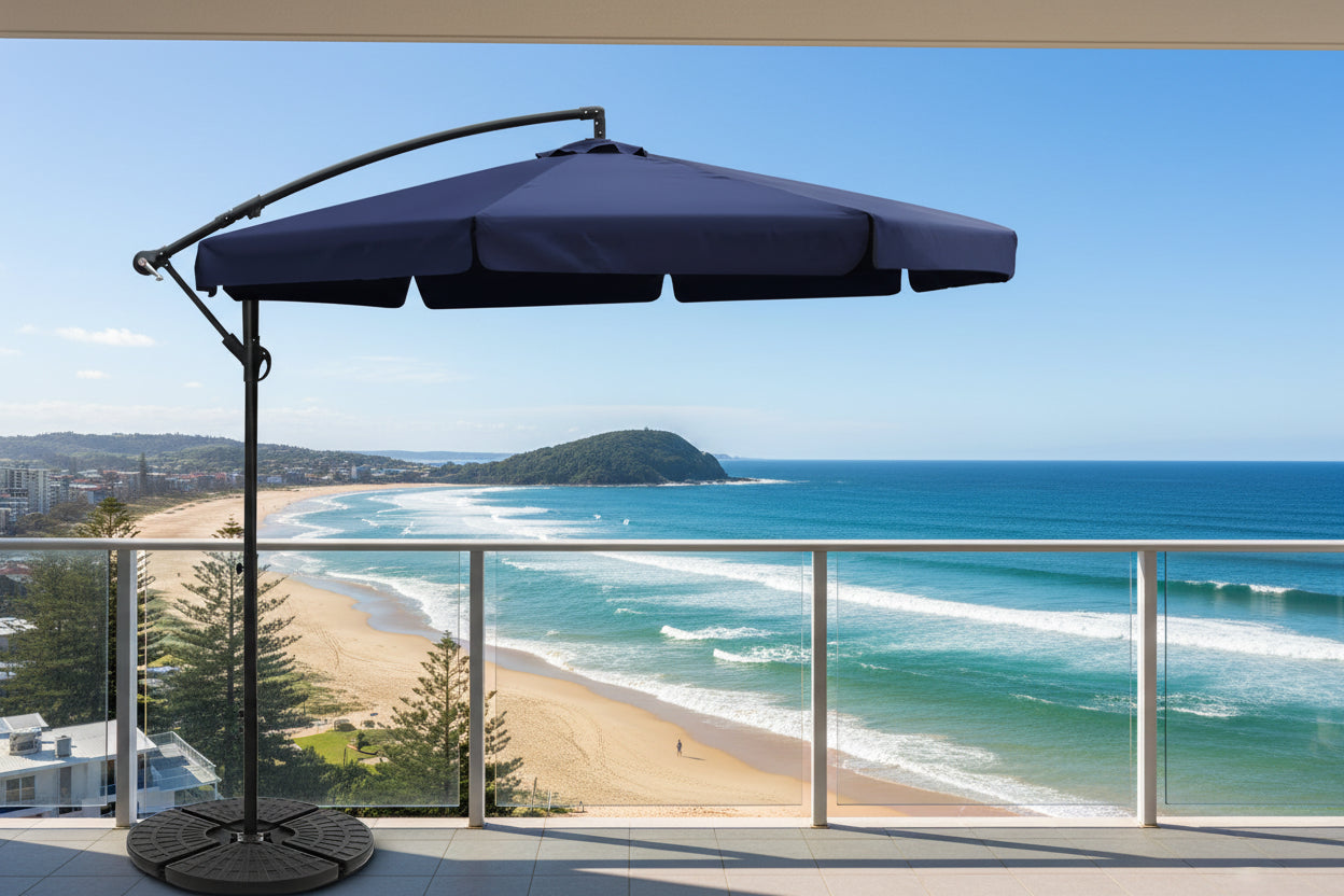 Black patio umbrella with a stand on a white background