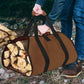 Brown duffel bag filled with firewood being carried by a person outdoors.