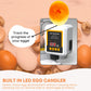 Egg incubator with LED candle feature surrounded by eggs on a peach background