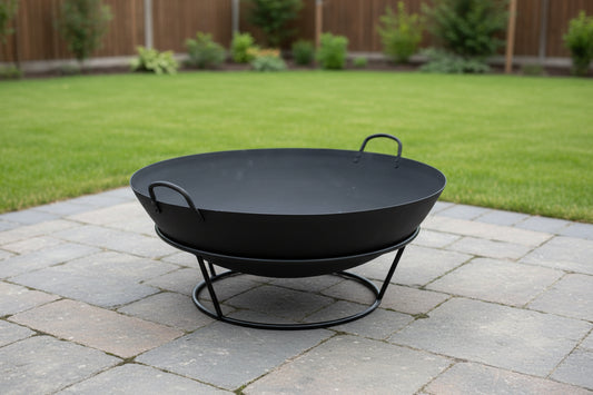 Black metal fire pit with a round design on a white background