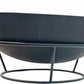 Black metal fire pit bowl with stand on a white background
